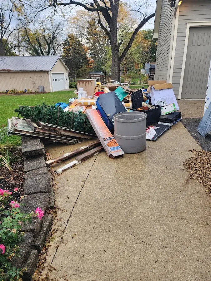 Dumpster being loaded with debris for 30 Yard Dumpster Rental in Charlotte
